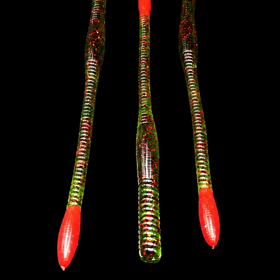 Three colorful fishing lures with red UV Glow tips on a black background