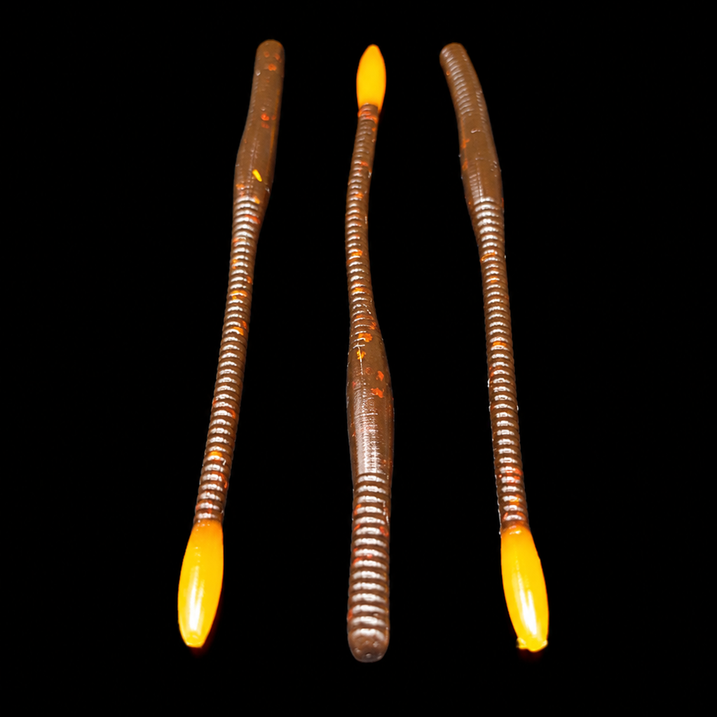 Three glowing lures with yellow tips on a black background