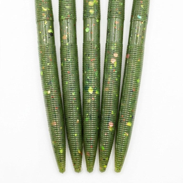 Five green fishing lures with a glittery finish on a white background
